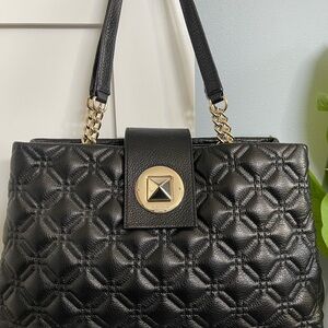 Kate Spade NY black quilted purse with gold chain accent and magnetic closure
